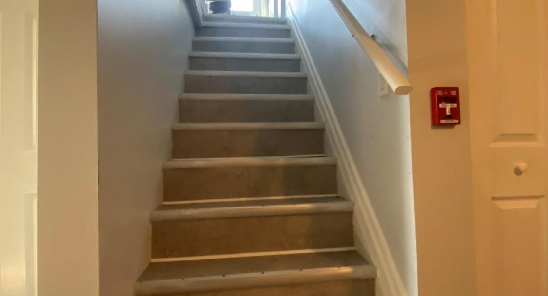 Stairs leading from the main floor to the basement 